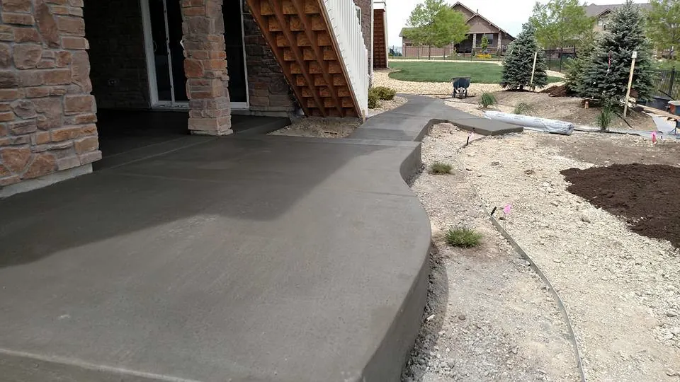 Curved patio under exterior stairs