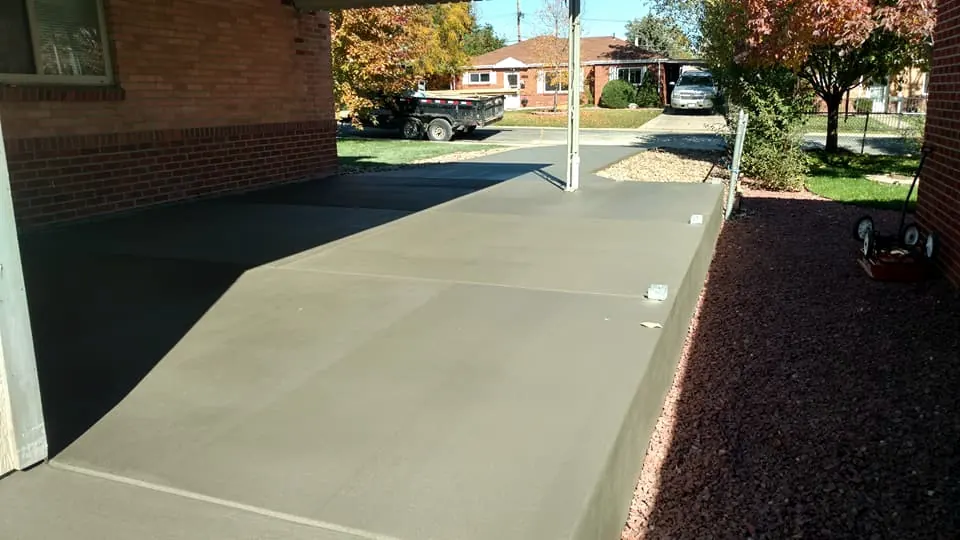 Driveway extension along the side of a garage