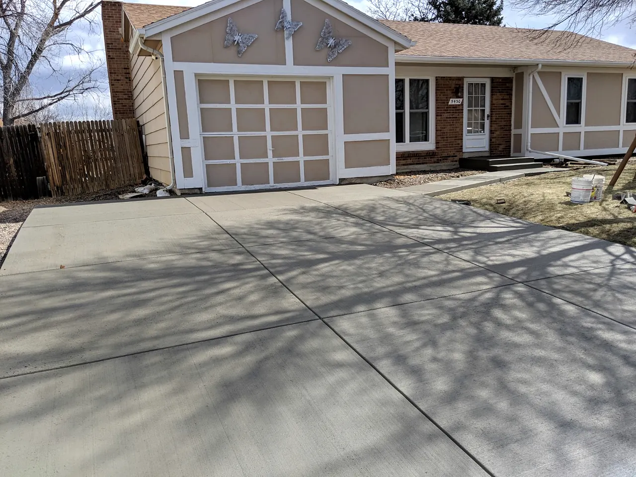 Replaced driveway in front of a detached garage
