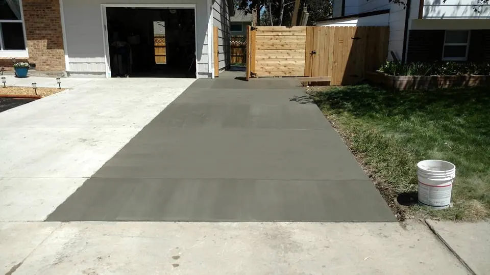 Replaced driveway section in front of a garage