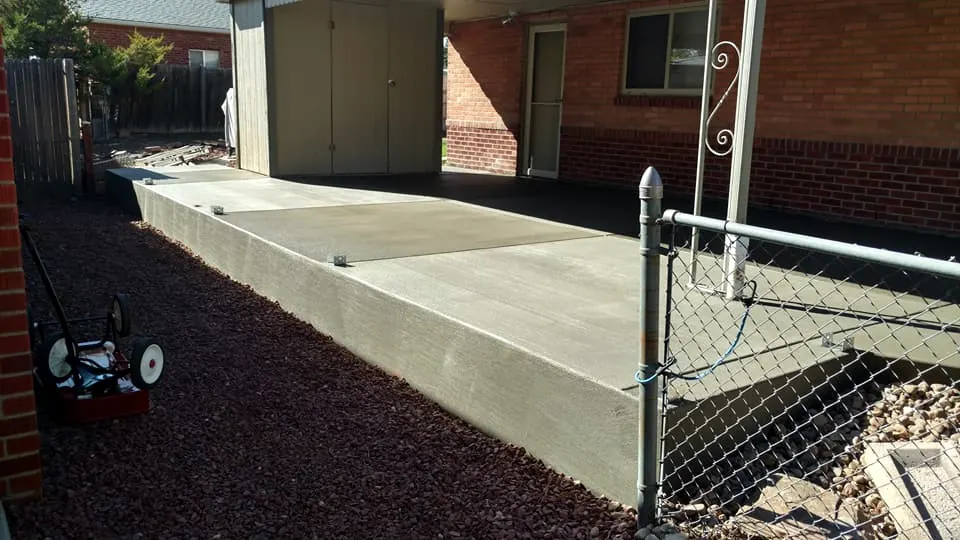 Patio slab running along a side fence