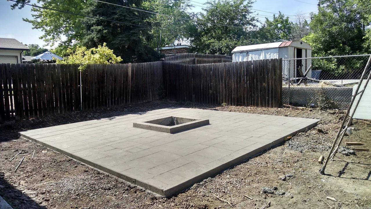 Backyard patio with a built-in square fire pit