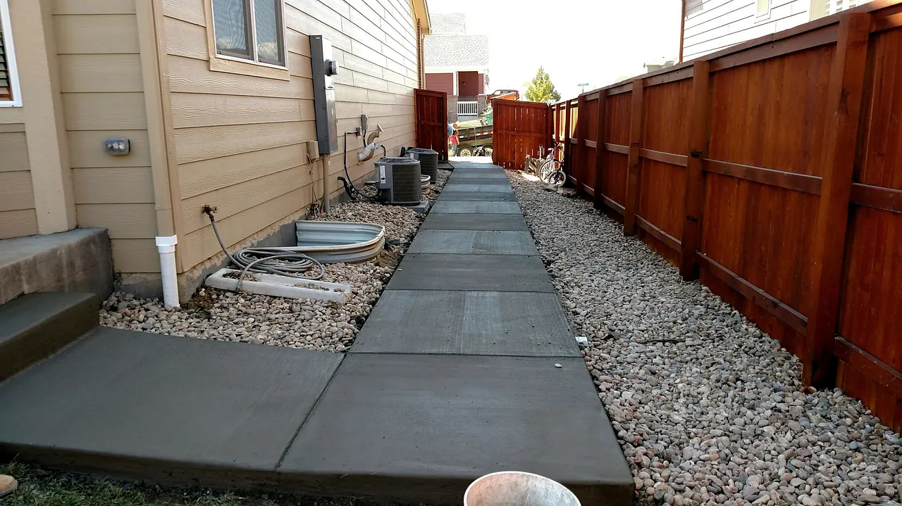 Side yard walkway between the house and fence